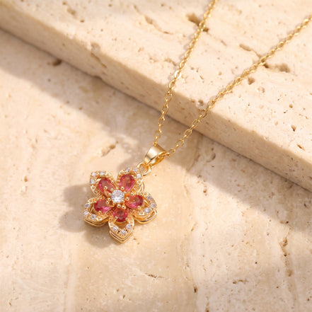 Flower pendant necklace with red stones