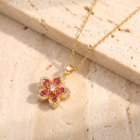 Flower pendant necklace with red stones