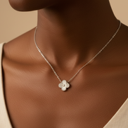 Necklace with a floral pendant on a model against a beige background