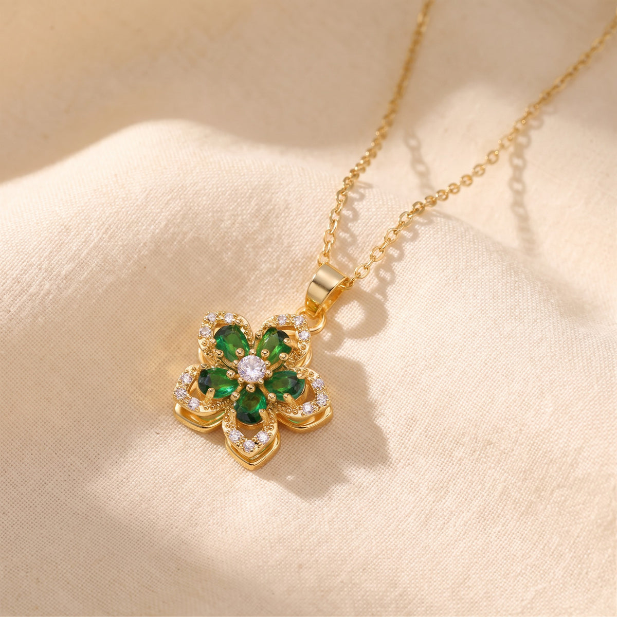 Flower pendant necklace with green stones