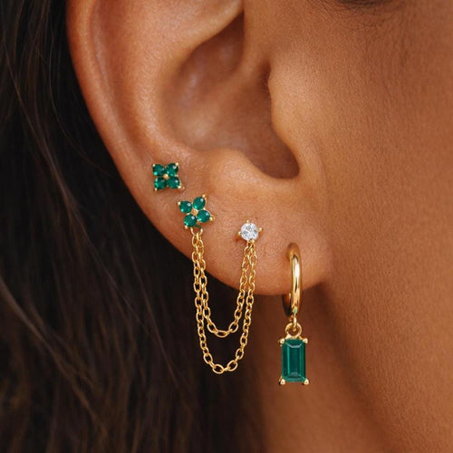 Emerald green CZ curated ear stack, gold flower stud double chain earring with baguette hoop drop, green crystal chain earring set, stacked piercing look, emerald gold ear stack jewelry for women