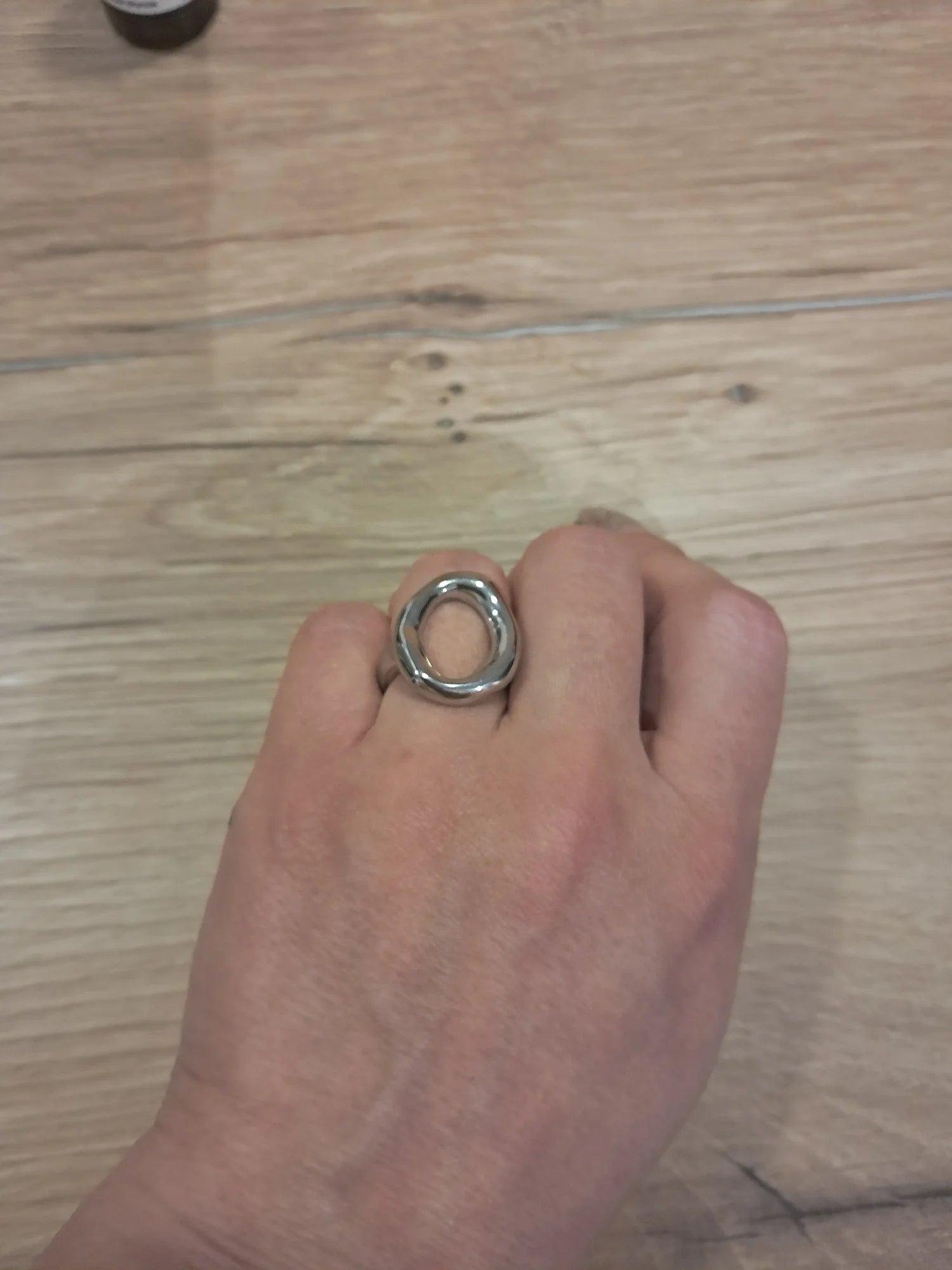 Close-up of the silver abstract oval ring