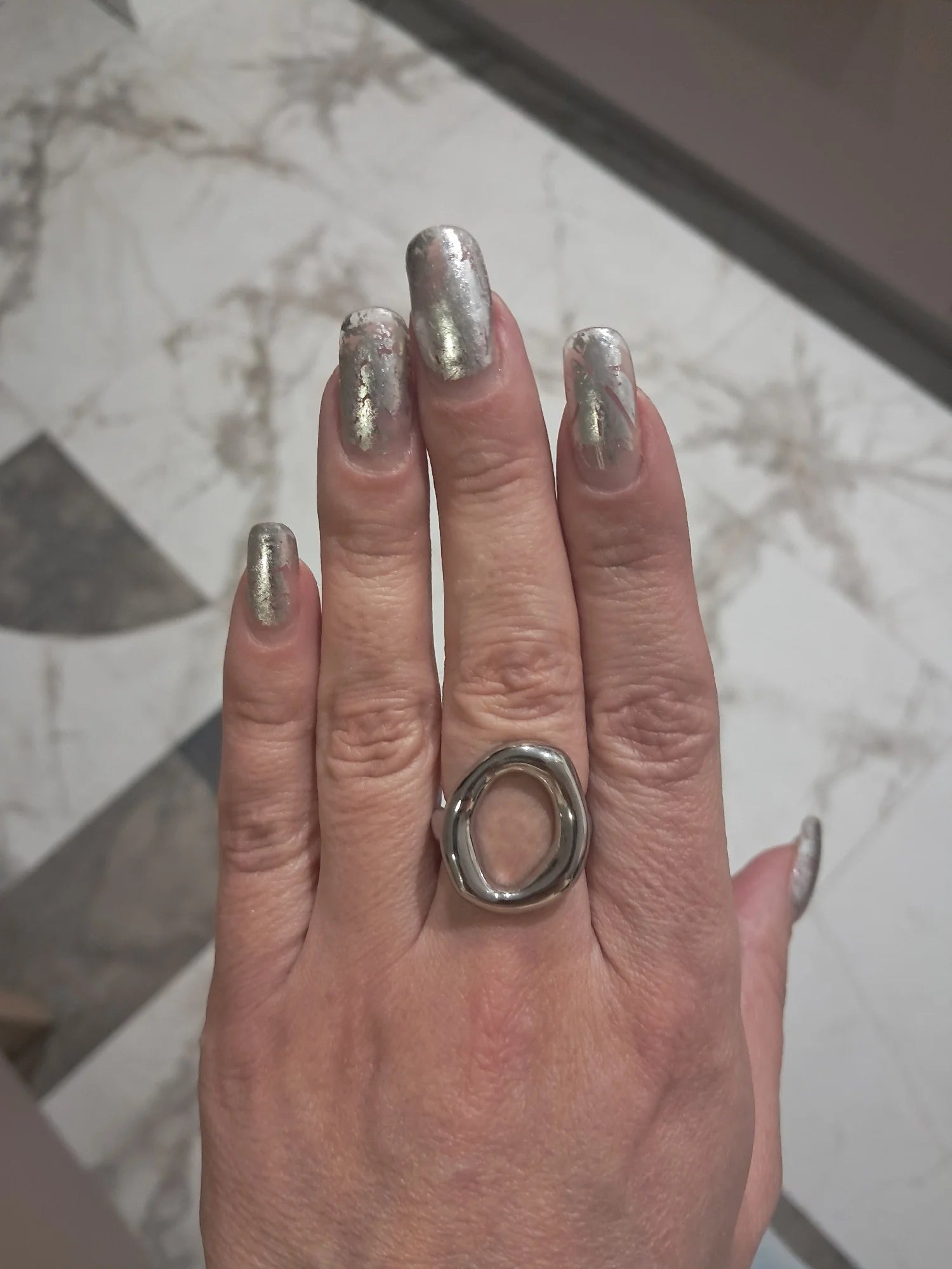 Customer photo of the silver abstract oval ring