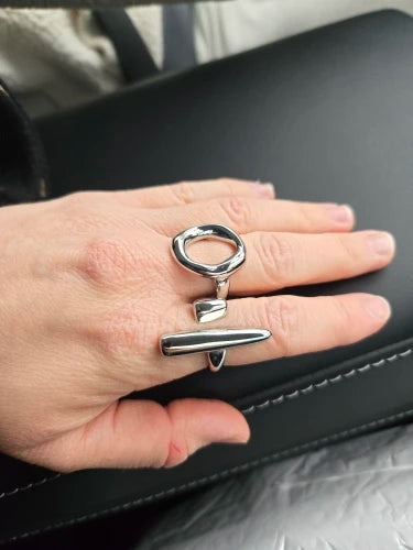Silver abstract oval ring worn with a second ring
