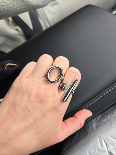 Customer hand wearing the silver abstract oval ring